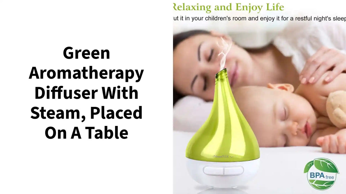 Green aromatherapy diffuser with steam, placed on a table by@Outfy